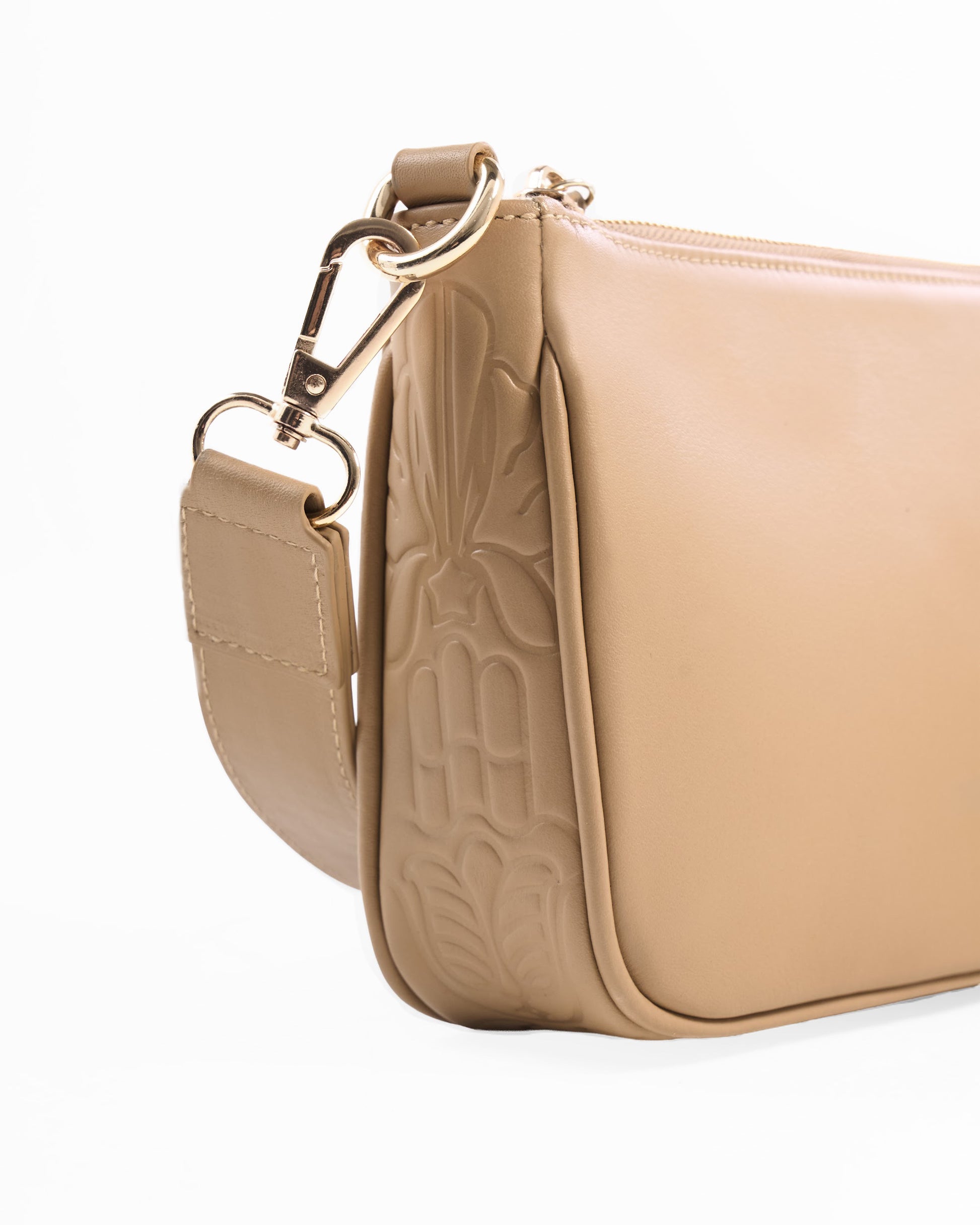 Two beige handbags with gold accents on a white background